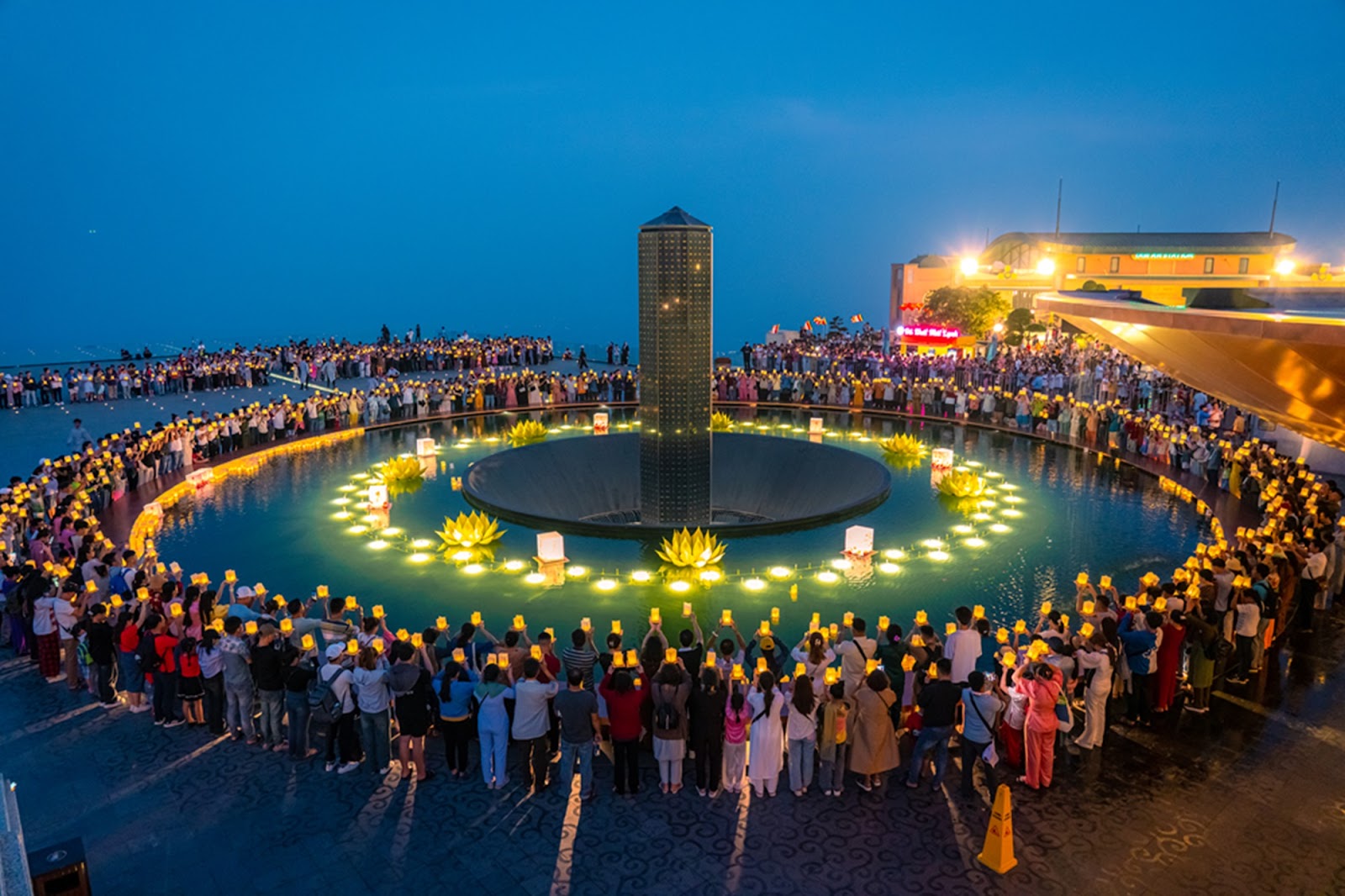 Tourists attend the lantern offering ceremony on the summit of Ba Den Mountain.