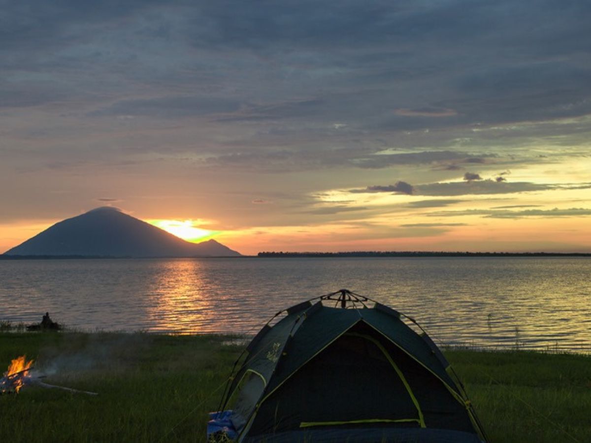 Camping watching sunset by Tay Ninh's Dau Tieng Lake.